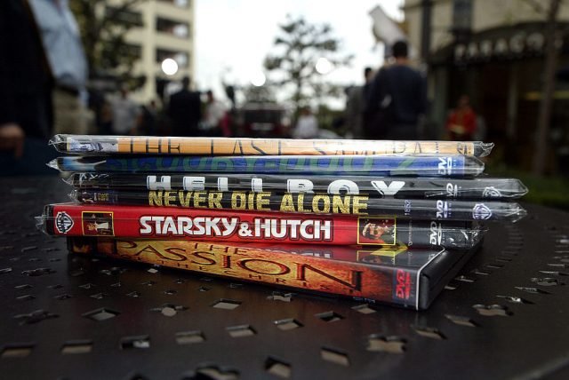 A stack of DVDs sits on a table  (Photo Credit: Frazer Harrison/Getty Images)