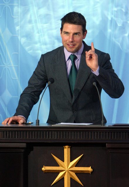 US actor, Tom Cruise speaks during the inauguration of the Church of Scientology in Madrid, 18 September 2004 (Photo Credit: PIERRE-PHILIPPE MARCOU/AFP via Getty Images)