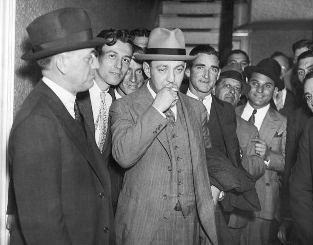 Arthur Flegenheimer, Alias Dutch Schultz, N.Y. Beer Baron and Racketeer shown in front of N.Y. Federal Court, 1935. (Photo Credit: Bettmann / Contributor)