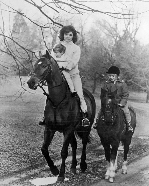 A beautiful family portrait of jackie bouvier kennedy with her children riding in the woods. Jackie kennedy holding on tightly to her youngest son, john as she rides on her horse with eldest daughter, caroline, riding on her own little pony. (photo credit: bettmann / contributor)