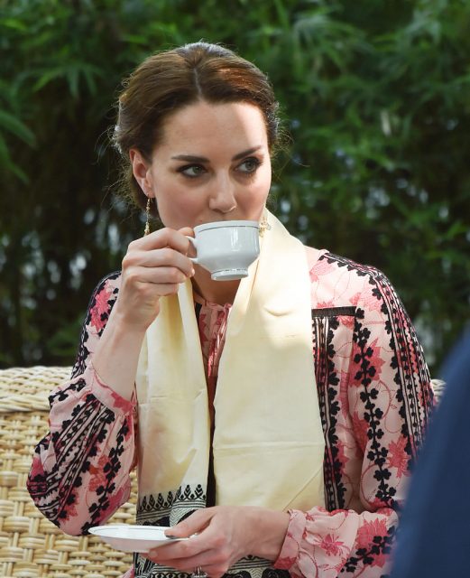Catherine, Duchess of Cambridge drinks a cup of tea as she visits the Centre for Wildlife Rehabilitation and Conservation at Kaziranga National Park on April 13, 2016 in Guwahati, India. (Photo Credit: Samir Hussein/Pool/WireImage)