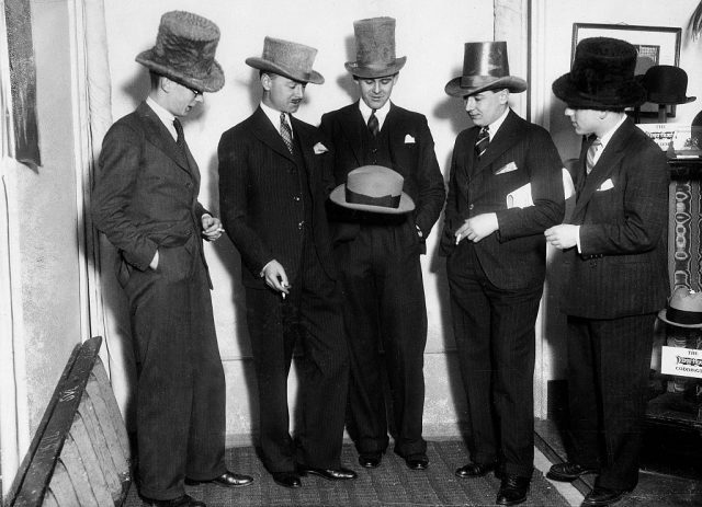 Men’s fashion Men in pinstripe suits and hats in different designs (Photo Credit: ullstein bild/ullstein bild via Getty Images)