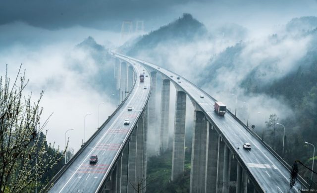Fog surrounds the Sidu River Bridge after rain in Enshi, Hubei Province of China. (Photo Credit: Visual China Group via Getty Images)