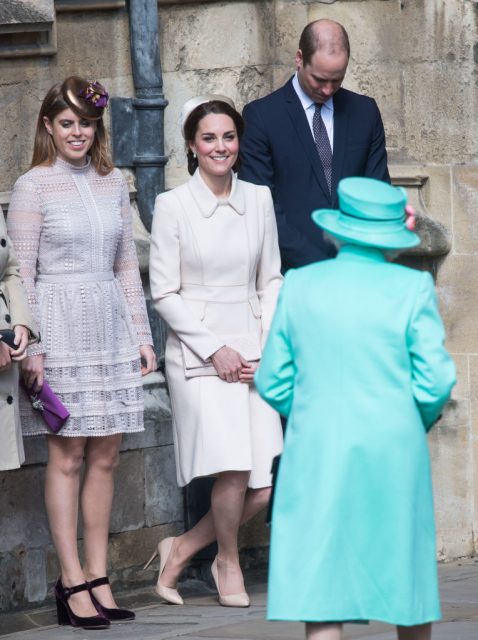 Catherine, Duchess of Cambridge performs a curtsy to Queen Elizabeth II as she attends Easter Day Service with Prince William, Duke of Cambridge and Princess Beatrice of York at St George’s Chapel on April 16, 2017 in Windsor, England. (Photo Credit: Samir Hussein/Samir Hussein/WireImage)