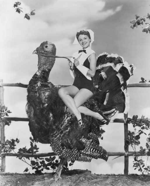 Virginia Gibson dressed as a pilgrim, riding a large turkey