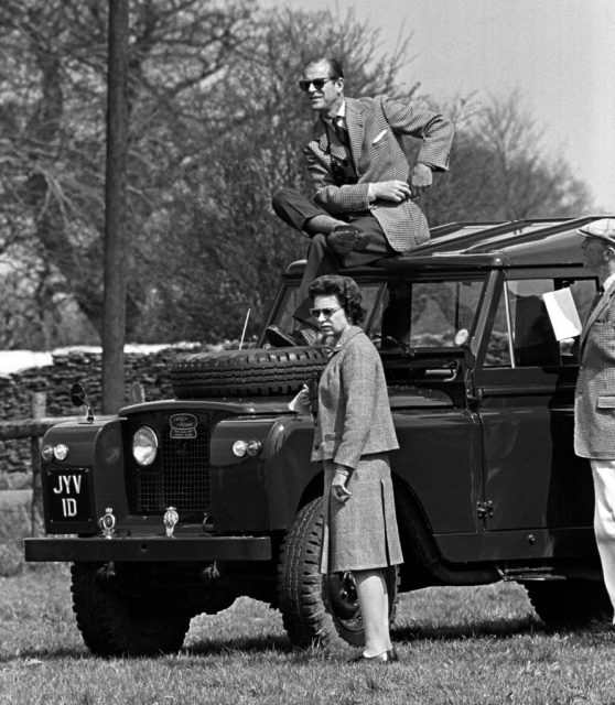 Prince philip, the duke of edinburgh, perches on the roof of a land rover but queen elizabeth ii prefers a ground-level view of competitors during the horse trials at badminton, gloucestershire. (photo credit: pa/pa images via getty images)