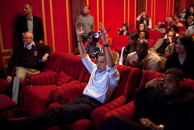 In this handout from the White House, U.S. President Barack Obama watches the Super Bowl during a Super Bowl party in the family theater of the White House February 2, 2009 in Washington, DC. (Photo Credit: Pete Souza/White House via Getty Images)