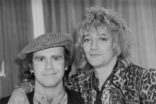 British singer, pianist and composer Elton John with British rock singer and songwriter Rod Stewart at the Olympia, London, UK, 22nd December 1978. (Photo Credit: Evening Standard/Hulton Archive/Getty Images)