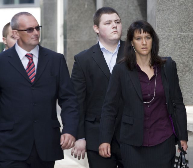 Jamie Waylett walking outside a courthouse with other people