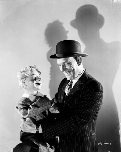 Lon Chaney holding a ventriloquist dummy