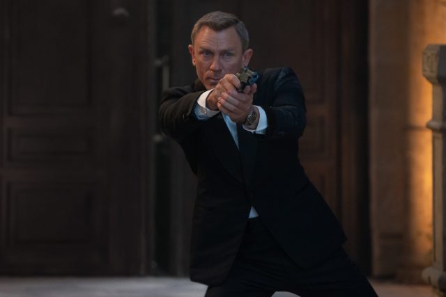 James Bond aiming a handgun