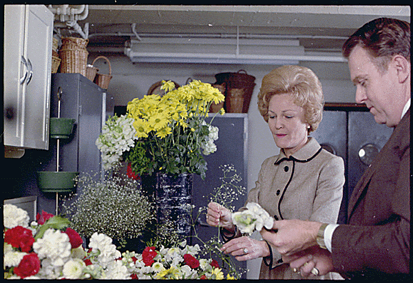 First Lady Pat Nixon works with flowers (Photo Credit: Jack E. Kightlinger – This media is available in the holdings of the National Archives and Records Administration, cataloged under the National Archives Identifier 194341, Public Domain)