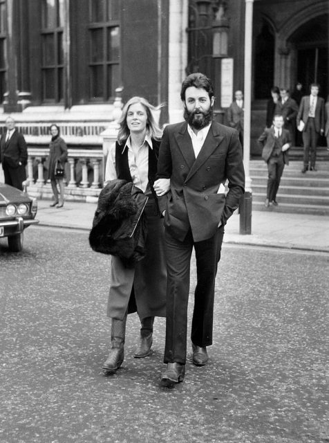 Linda and Paul McCartney walking away from a courthouse