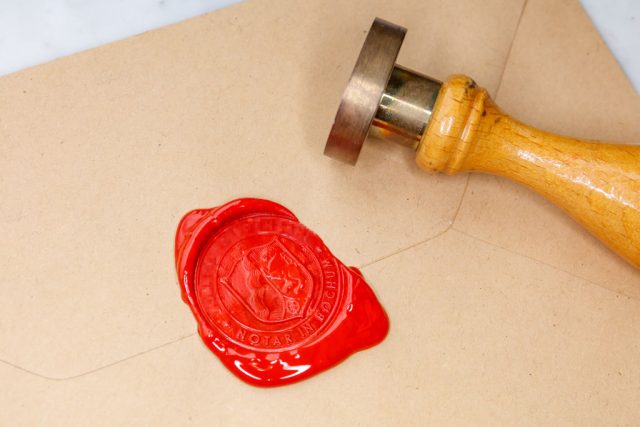 In this photo illustration, a seal out of sealing wax with a stamp on a document cover is seen (photo credit: mario hommes/defodi images via getty images)