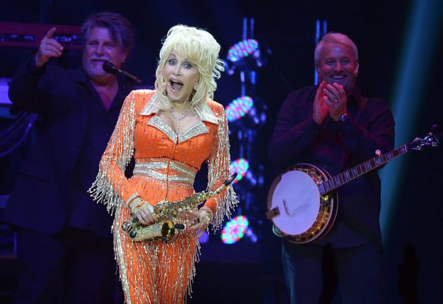 Dolly Parton standing on stage