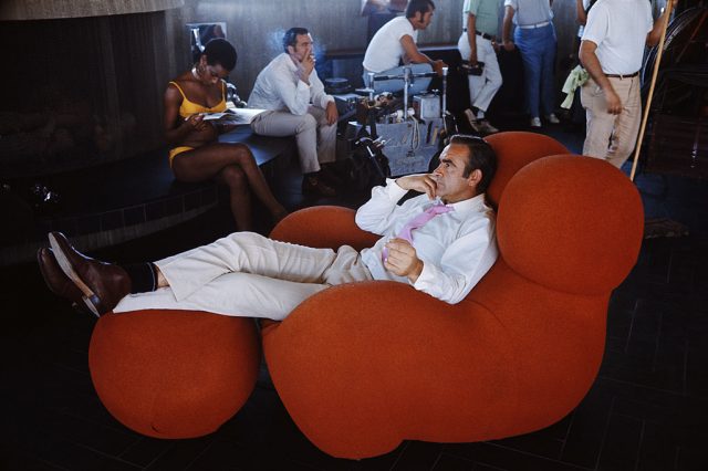Scottish actor Sean Connery relaxes between takes on the set of the James Bond film 'Diamonds Are Forever