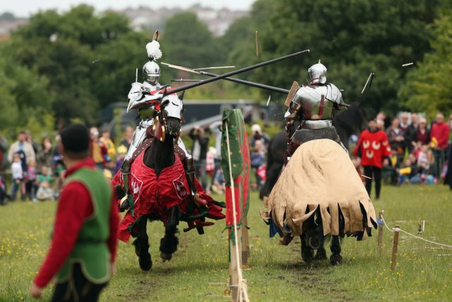Re-enactors dressed as knights stage a medieval jousting competition at Eltham Palace