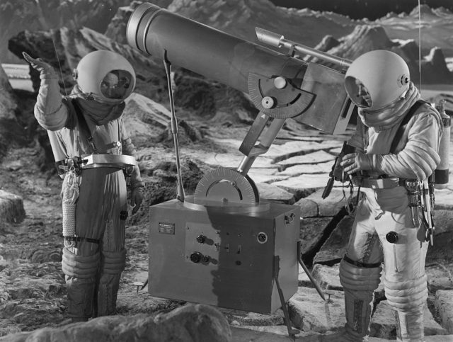 Two astronauts operate a powerful lunar telescope in a scene from the film ‘Destination Moon’, a surprisingly accurate prediction of space travel which won an Academy Award for Best Special Effects. The film was directed by Irving Pichel for George Pal Productions. (Photo Credit: Keystone/Getty Images)