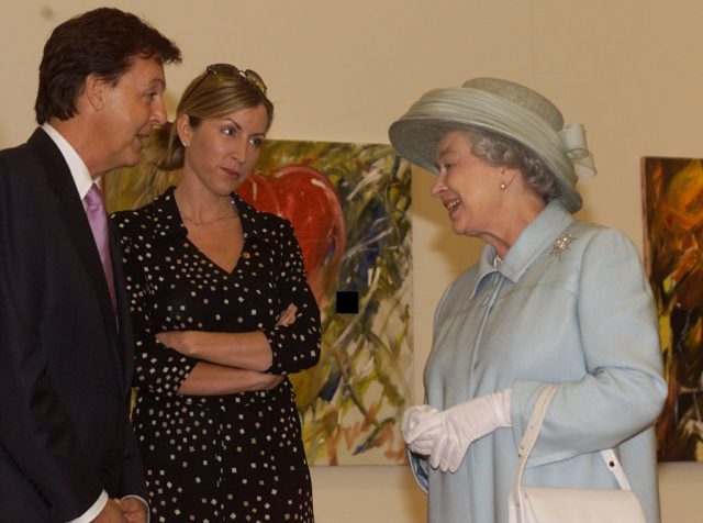 Sir Paul McCartney, with his wife, Heather Mills, with Britain's Queen Elizabeth II