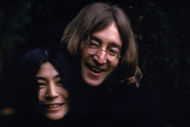 John Lennon smiling with Yoko Ono