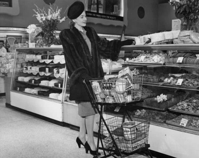 Woman selecting objects in supermarket