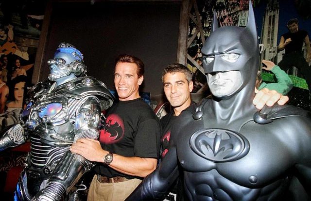Arnold Schwarzenegger and George Clooney pose with their costumes