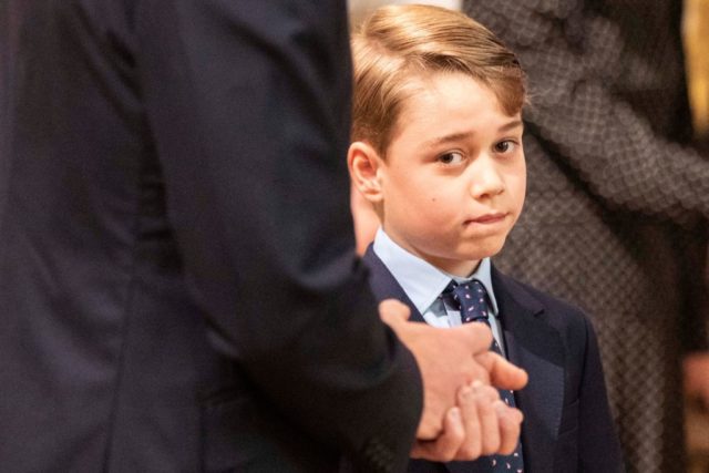 Prince George looks into the camera while at a memorial service for Prince Philip
