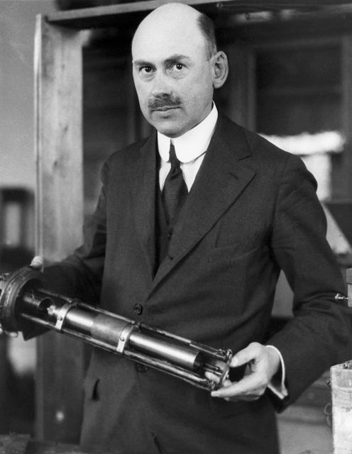 Robert H. Goddard holding a rocket