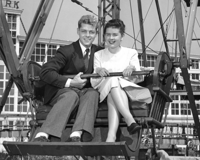 Couple sitting on a ferris wheel