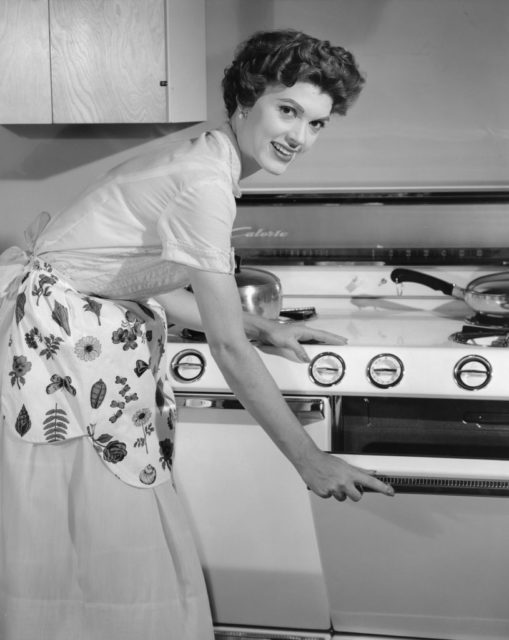 Woman opening the stove