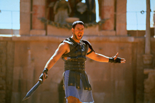 Russell Crowe dressed in period costume and holding a sword in 'Gladiator'