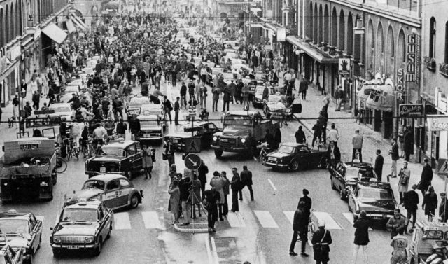 A Swedish road is jammed with cars and people on the day that Sweden changed to driving on the right side of the road.