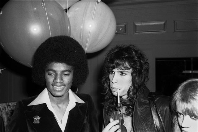 Michael Jackson and Steve Tyler standing together