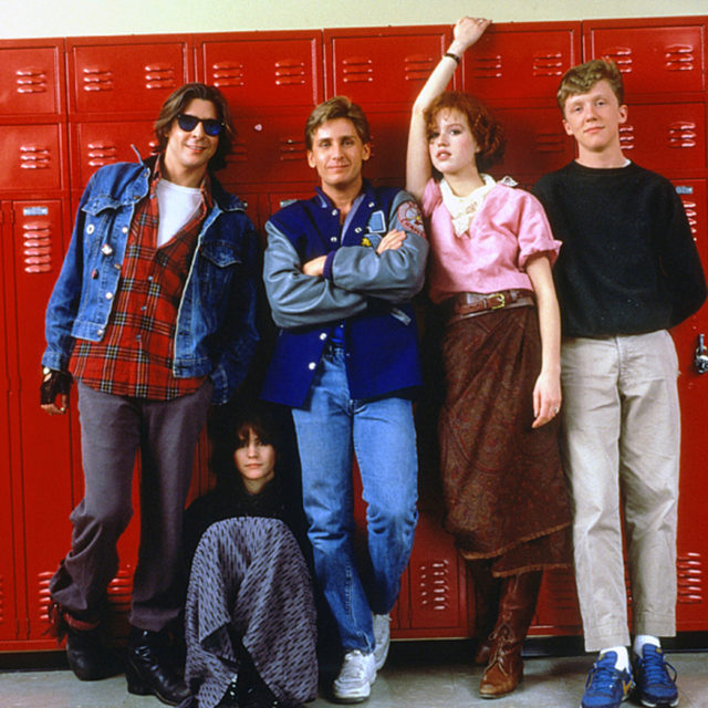 the cast of 'The Breakfast Club' pose in front of red lockers