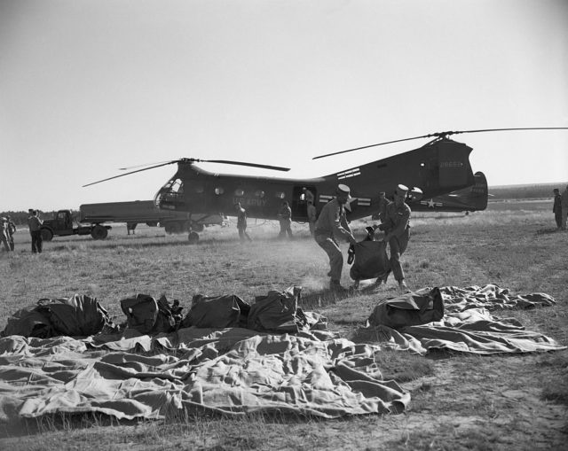 US Army putting human remains into body bags 