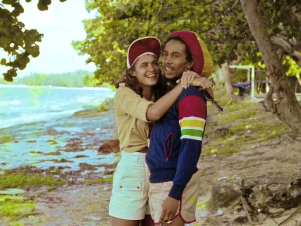 Bob Marley chilling on a beach with Miss World 1976 Cindy Breakspeare, mother of Damien Marley.