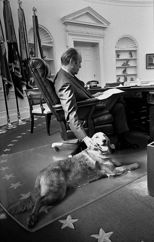 Gerald Ford and his golden retriever, Liberty,  in the Oval Office in 1974.