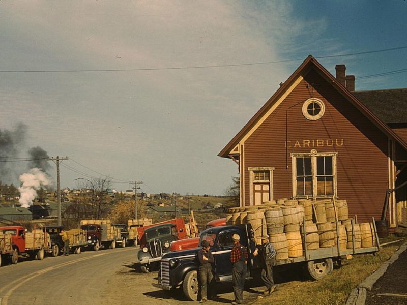 Trucks outside of a starch factory, Caribou, Aroostook County, Me
