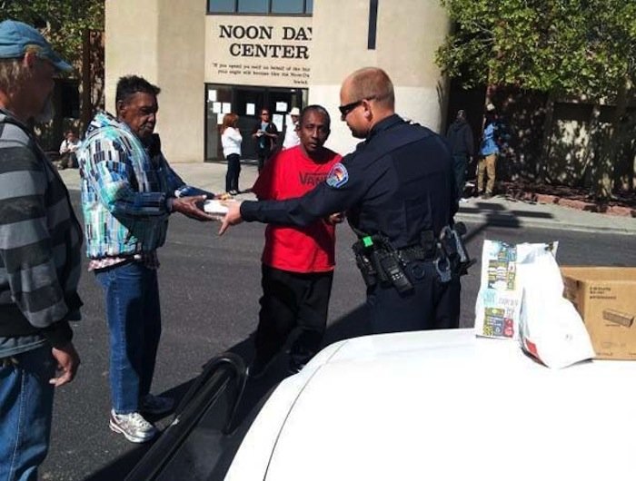 When this police officer learned the Day Center was closed, he bought food for 20 people who had come there to eat.