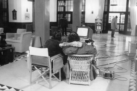 Actor Jack Nicholson and Director Stanley Kubrick review material on a video monitor on the Lobby set of The Shining. Actor Scatman Crother