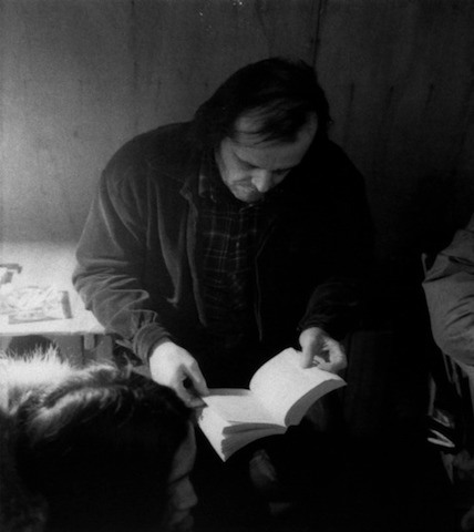 Actor Jack Nicholson reading between takes on the set of The Shining.
