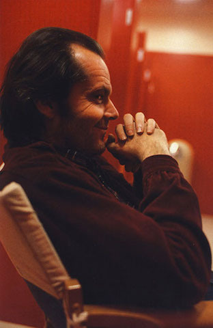 Actor Jack Nicholson reading between takes on the set of The Shining.fff