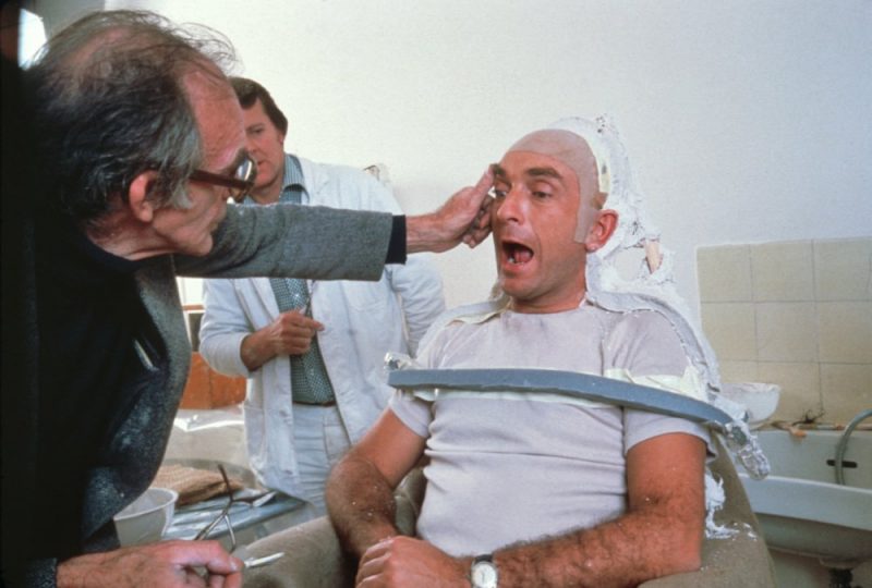 Actor Paul Freeman sits in the makeup chair, ready to have his face transformed for a heated moment as the villainous French archaeologist Belloq