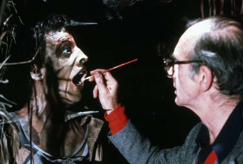 Adding the finishing touches to the special makeup effects for the opening scene in which one of Belloq’s greedy stooges gets his comeuppance