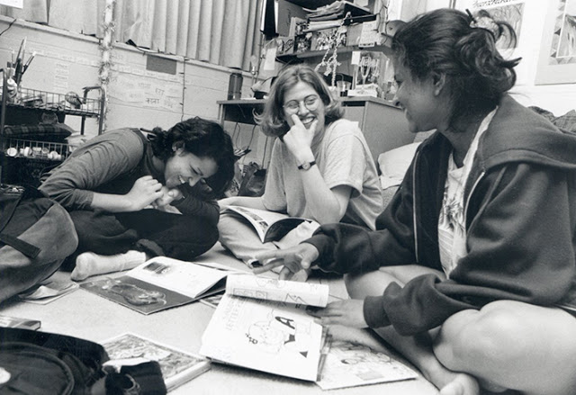 Students studying in their residence hall den, May 1996.