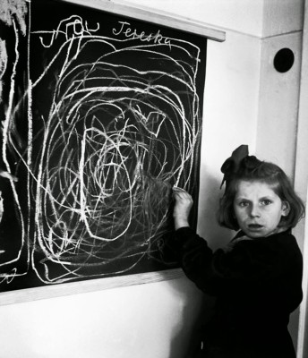 A girl who grew up in a concentration camp draws a picture of home while living in a residence for disturbed children, 1948