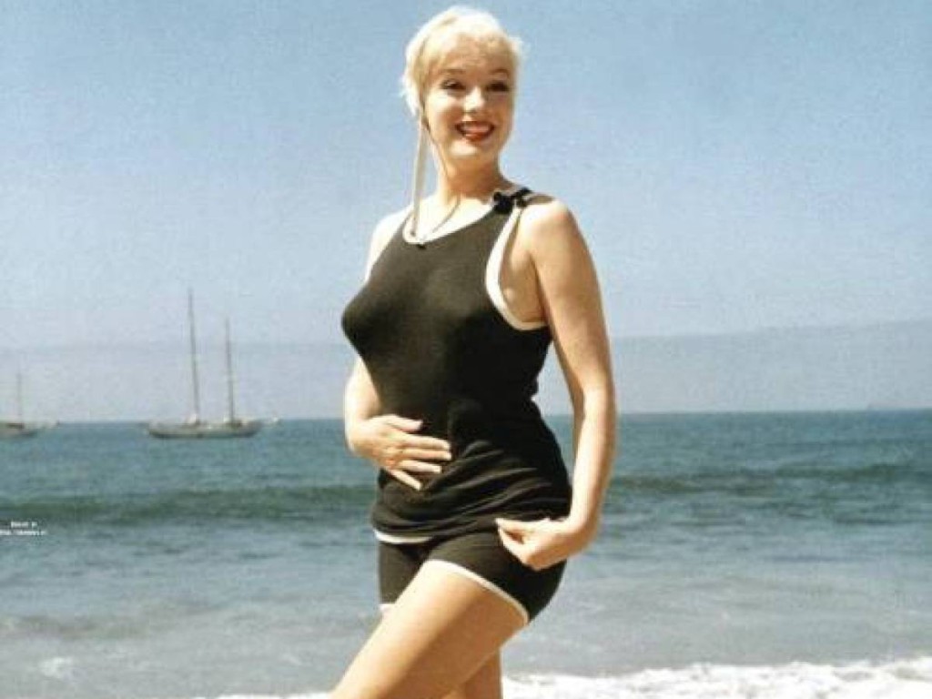 Marilyn Frolicks On The Beach In Her 1920's Get-Up