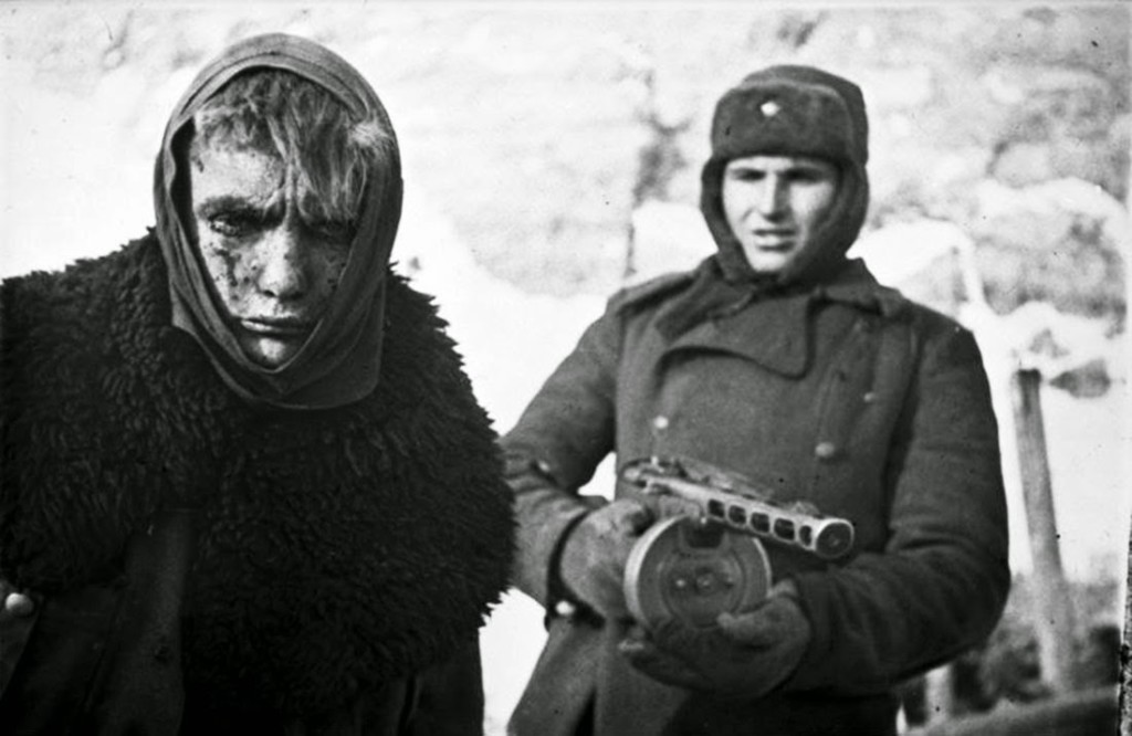 A German prisoner of war escorted by a Soviet soldier, Stalingrad, 1943