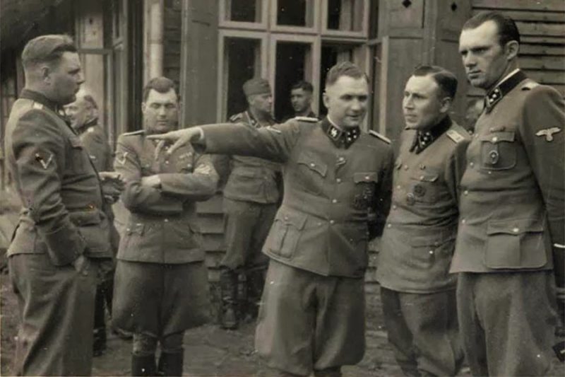 A group photo of the mass murderers of Auschwitz - Josef Kramer, Josef Mengele, Richard Baer, Karl Höcker (from left; man at right unidentified)