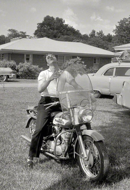 Elvis Presley, at age of 21, in front of his house , Memphis, 1956